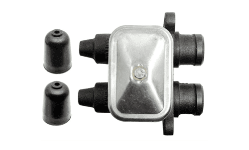 Automotive component with two rubber caps.