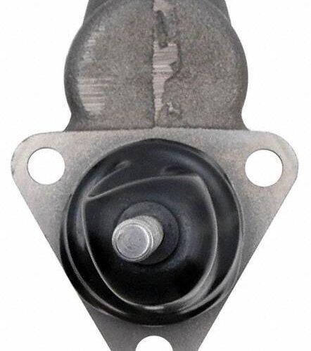 Automotive part with a round black component.