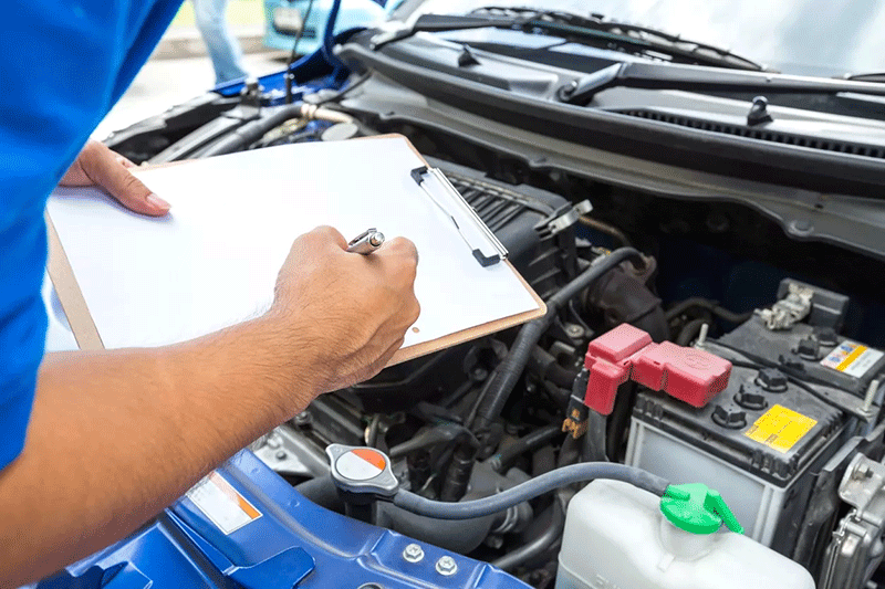 Inspector checking commercial truck with clipboard for DOT inspection in San Antonio TX